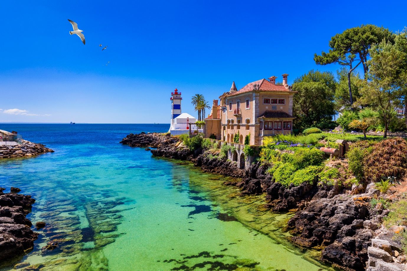 Beach, town and dock of Cascais at summer, Portugal