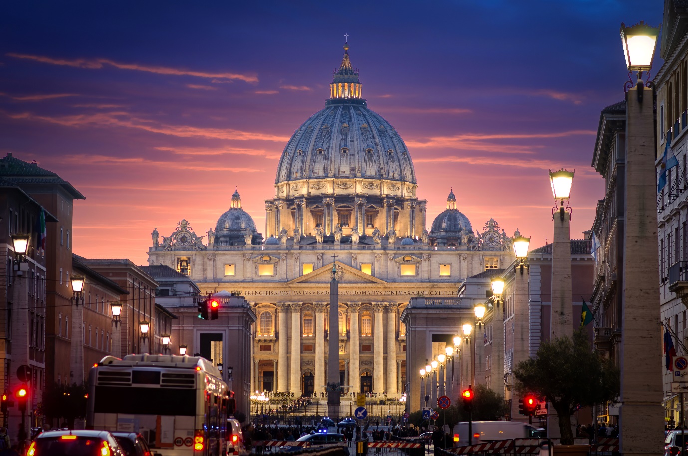 Rome, Italy view towards the Colosseum with archeological areas at sunset.